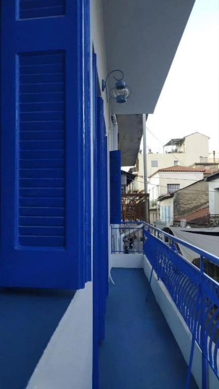 a blue door on the side of a balcony at Χαβίνη 35 in Amfilochia