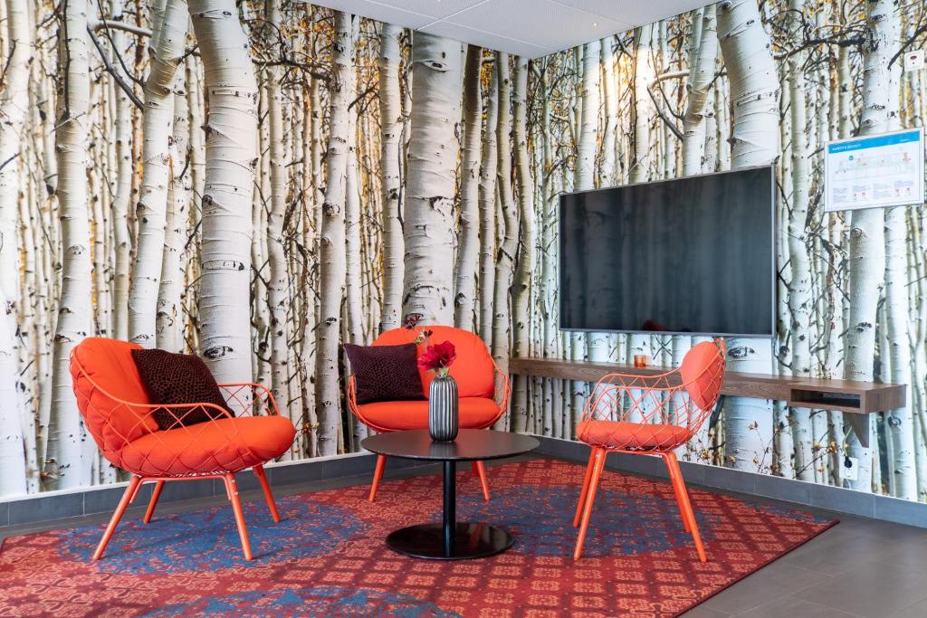 TV a/nebo společenská místnost v ubytování Best Western Plus Park City Lund