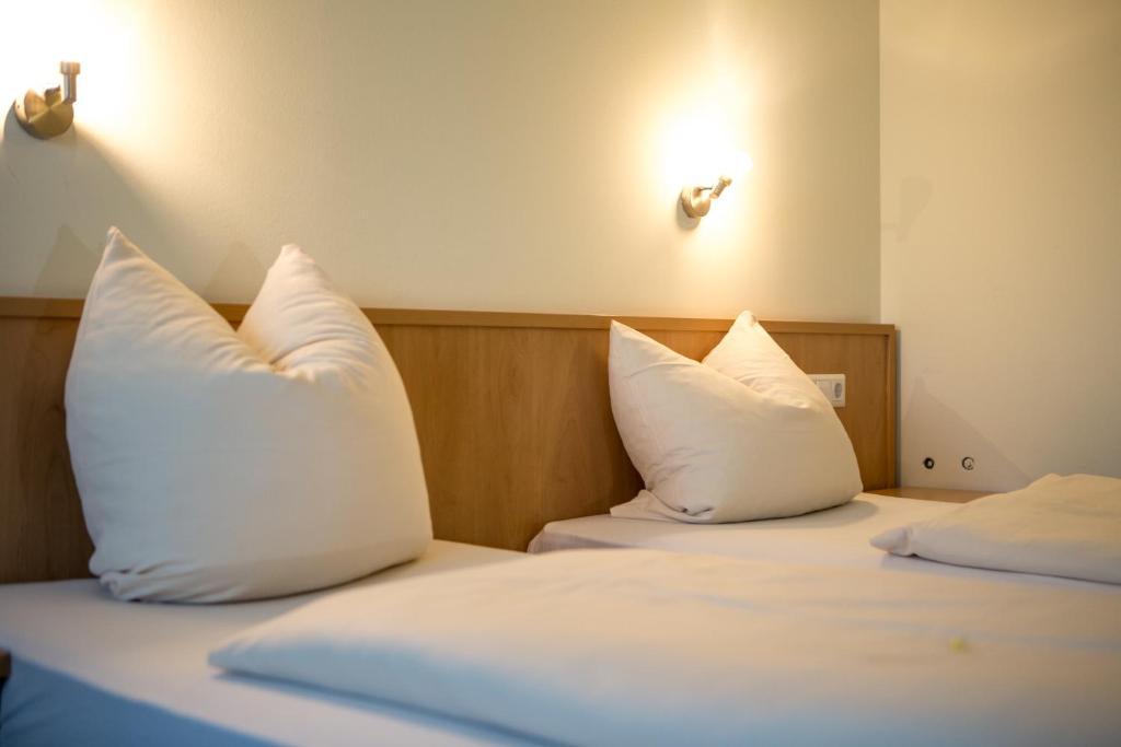 Postel nebo postele na pokoji v ubytování Hotel Thannhof