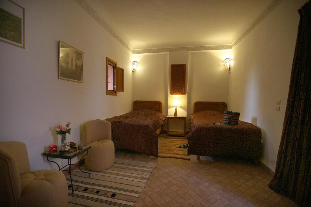 Posezení v ubytování Riad Chameau FDC Hôtel SPA