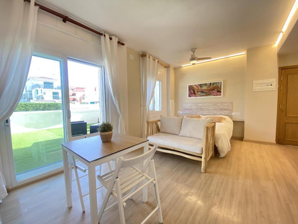 A seating area at R126 Beachfront Apartment Sant Salvador