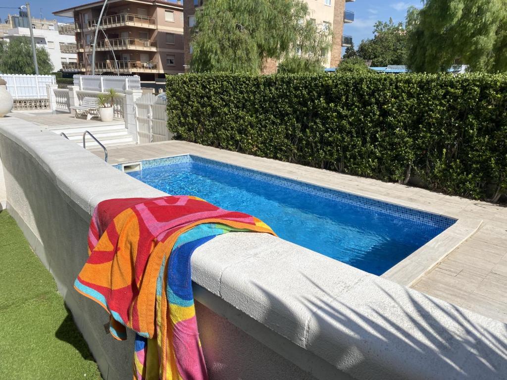 The swimming pool at or close to R126 Beachfront Apartment Sant Salvador