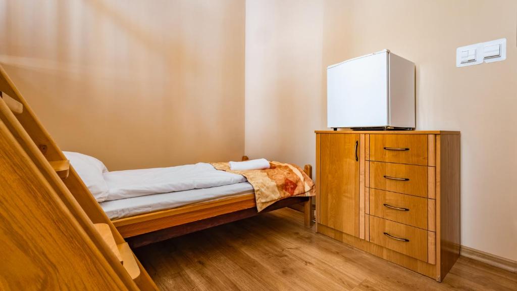 Postel nebo postele na pokoji v ubytování Ośrodek Wypoczynkowy Klub Mazurski