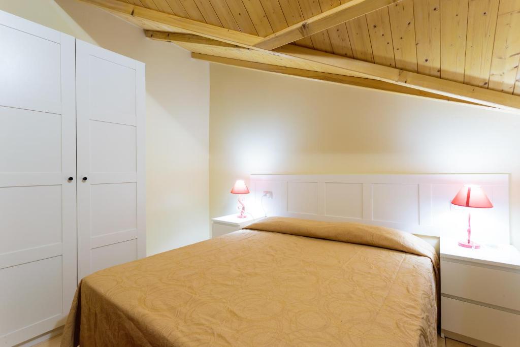 Letto o letti in una camera di Arcobaleno Village