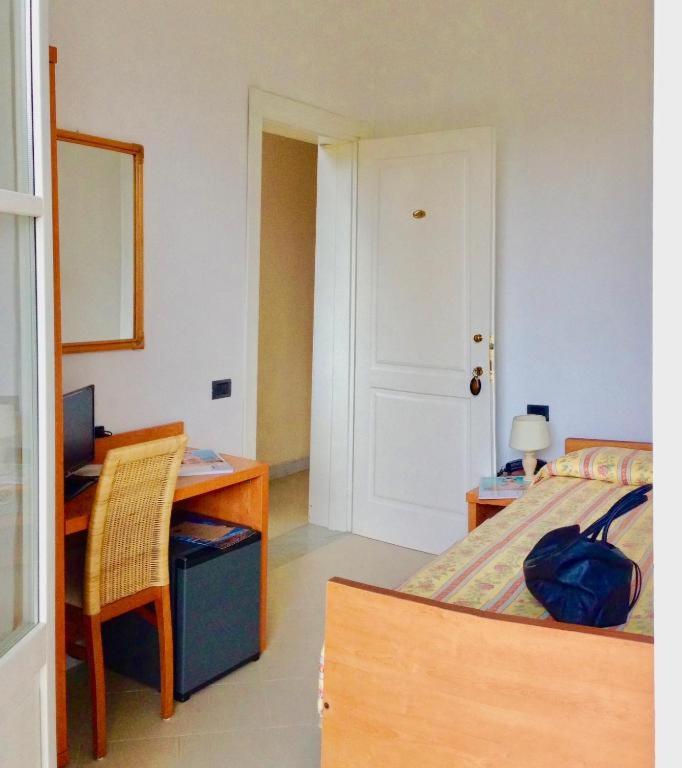 Postel nebo postele na pokoji v ubytování Hotel Villa Fiorisella