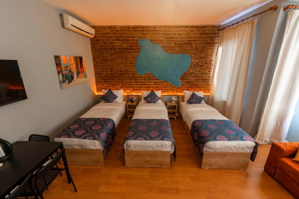 Postel nebo postele na pokoji v ubytování ROYAL TAKSIM SUITES