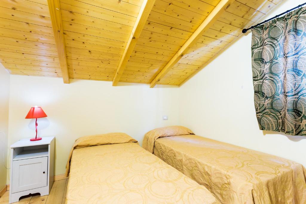 Letto o letti in una camera di Arcobaleno Village