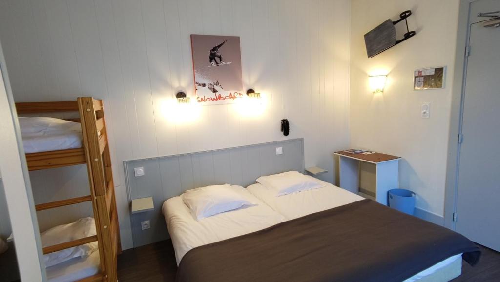 Postel nebo postele na pokoji v ubytování Hotel Le Colibri