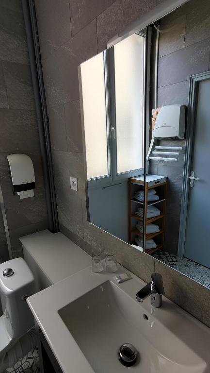 Koupelna v ubytování Hotel Le Colibri