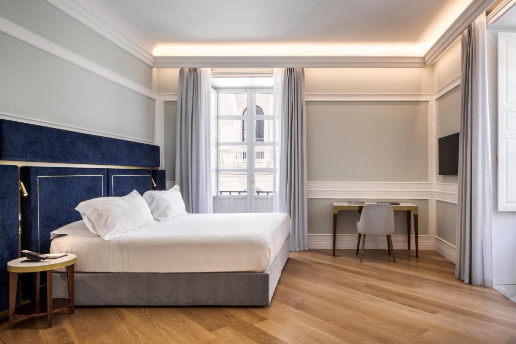 Postel nebo postele na pokoji v ubytování Palazzo Artemide - VRetreats