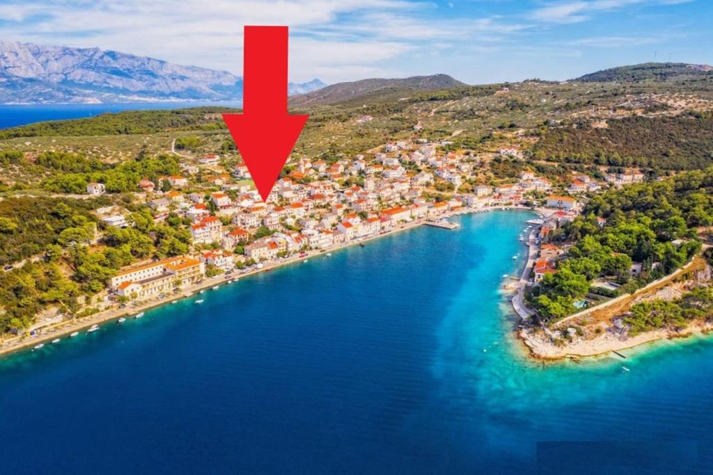 an aerial view of a small island in the water at Bobel Deluxe Tiny House in Povlja