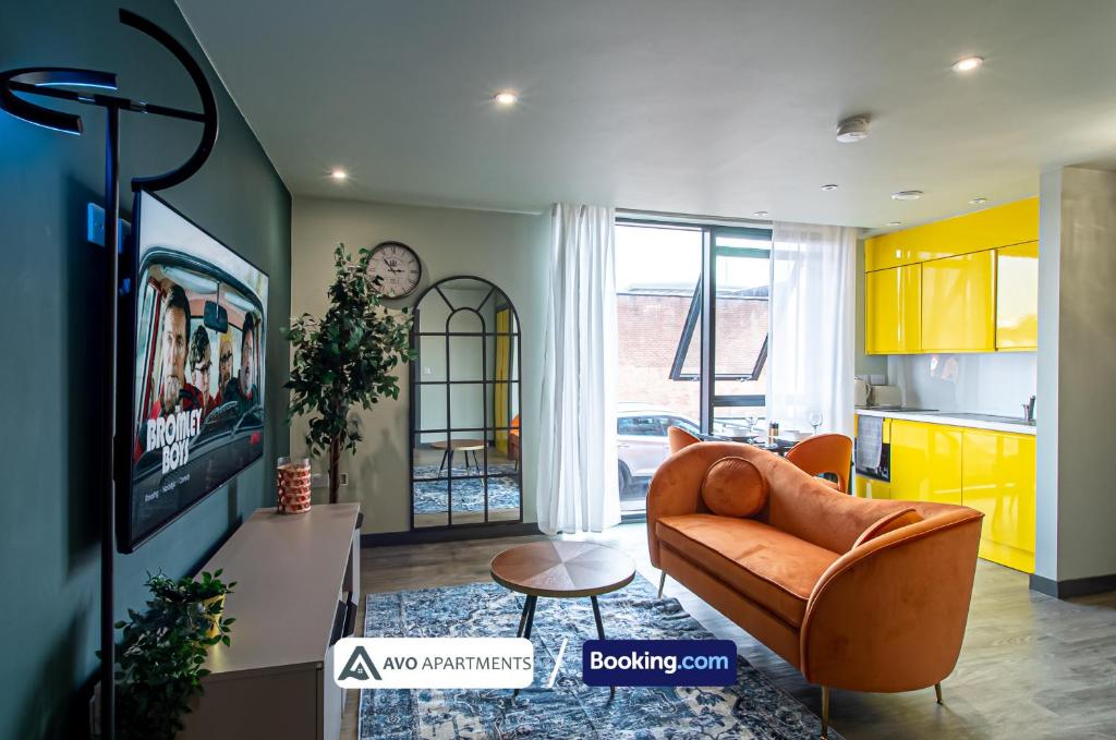 a living room with a couch and a table at Exquisite Central Suites Sheffield in Sheffield