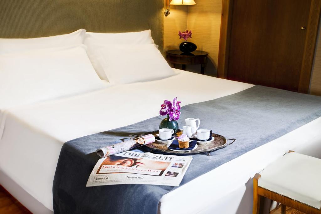 Postel nebo postele na pokoji v ubytování Hotel Valadier