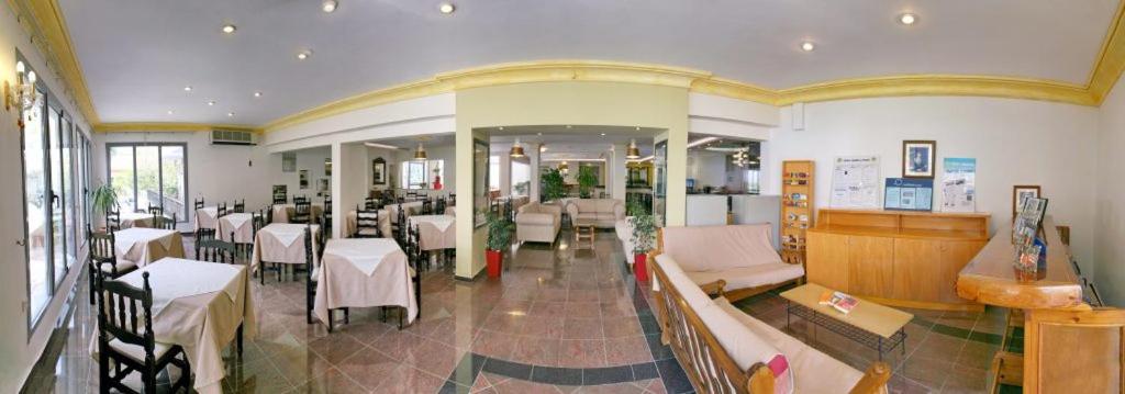 A restaurant or other place to eat at Theofilos Classic Hotel