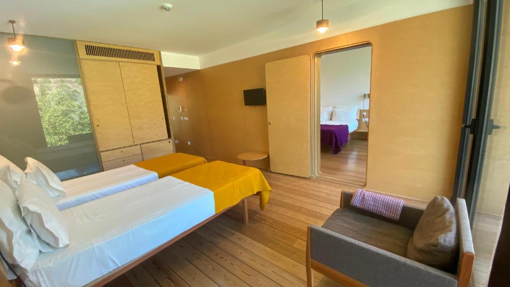 Uma cama ou camas num quarto em Colmeal Countryside Hotel