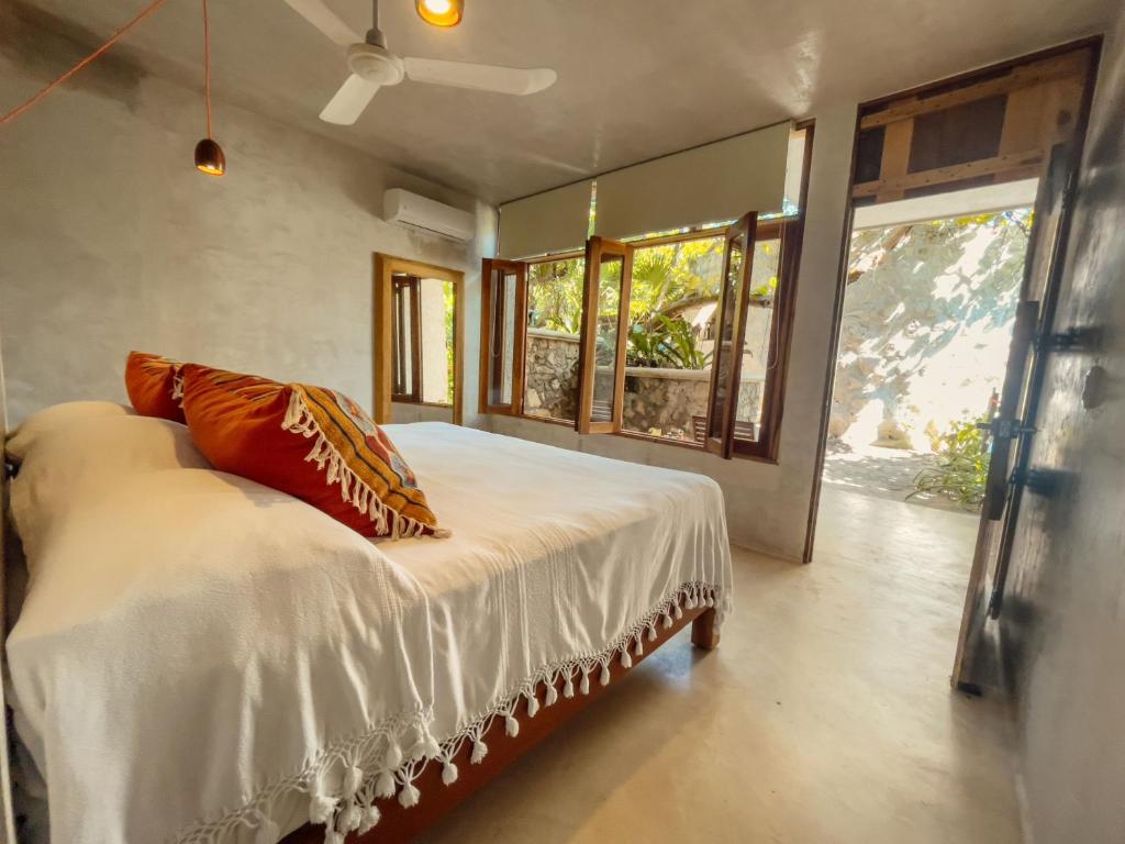 Postel nebo postele na pokoji v ubytování Hotel Poc Na Tulum
