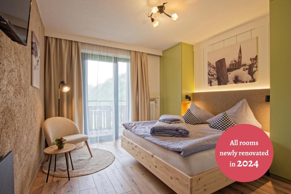 Postel nebo postele na pokoji v ubytování Bergchalet Hotel Reinerhof