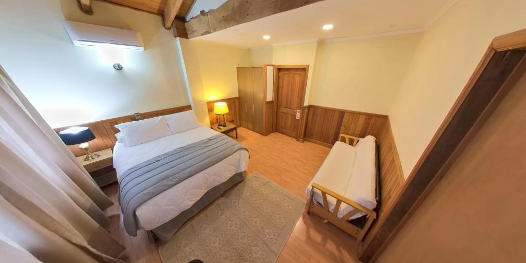 Ένα ή περισσότερα κρεβάτια σε δωμάτιο στο Hotel casona de los ríos