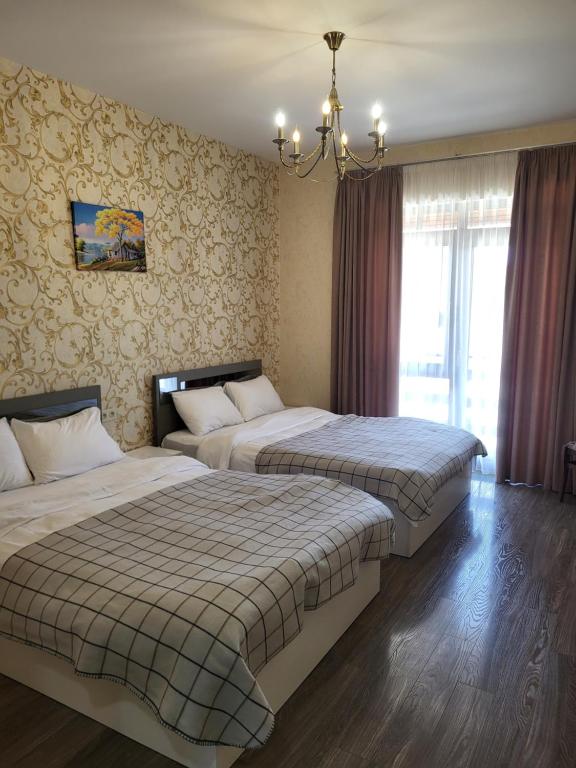 Postel nebo postele na pokoji v ubytování Villa Megobrebi
