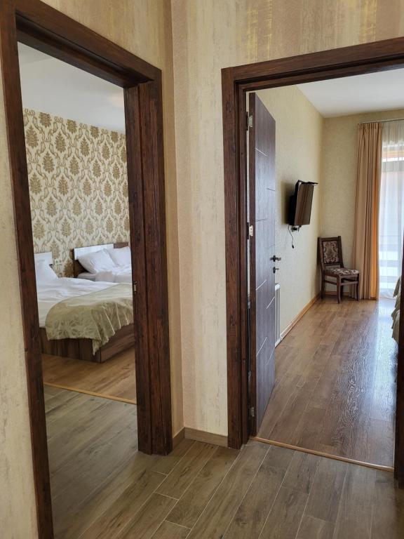 Postel nebo postele na pokoji v ubytování Villa Megobrebi