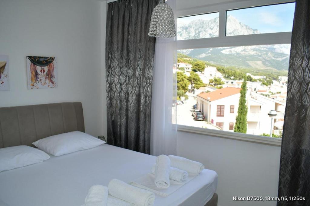 Postel nebo postele na pokoji v ubytování Apartmani Marić