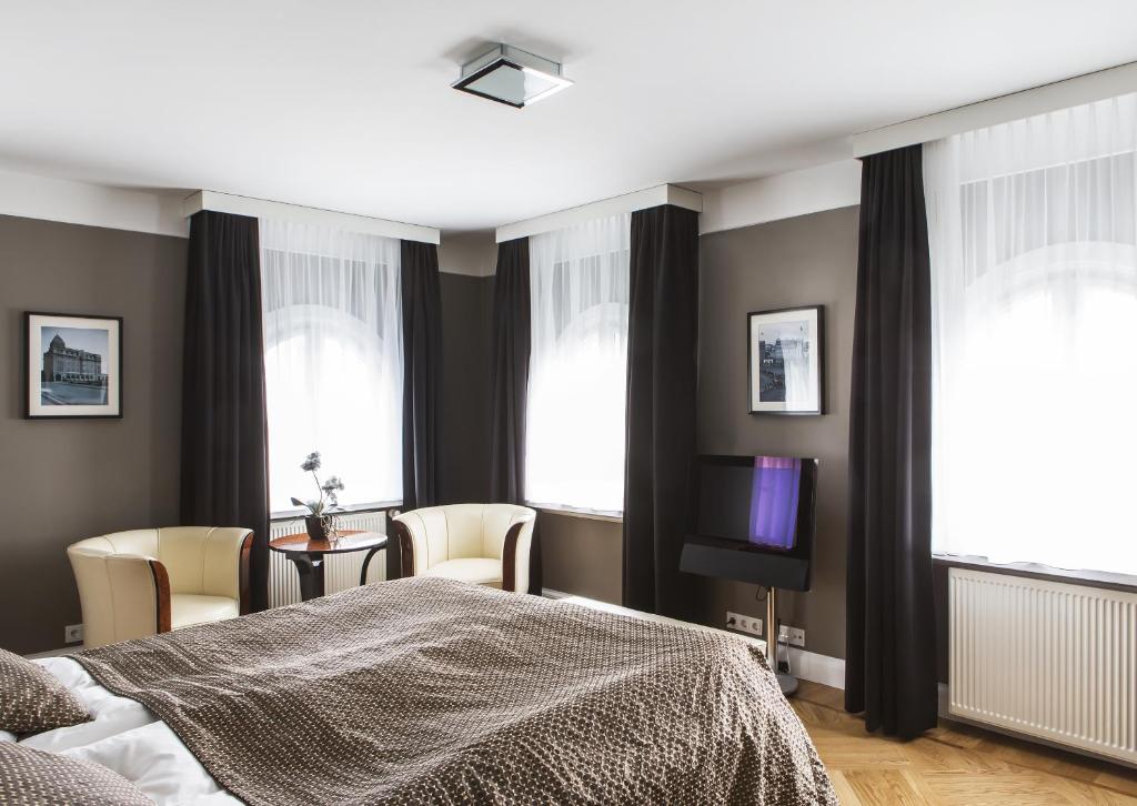 Postel nebo postele na pokoji v ubytování Hotel Borg by Keahotels