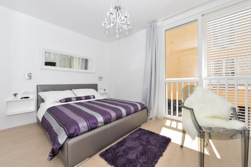 Posteľ alebo postele v izbe v ubytovaní Luka Residence Apartments