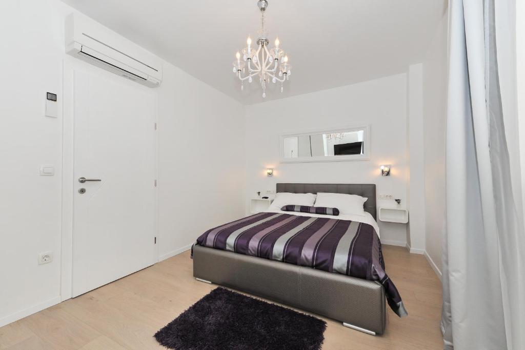 Posteľ alebo postele v izbe v ubytovaní Luka Residence Apartments