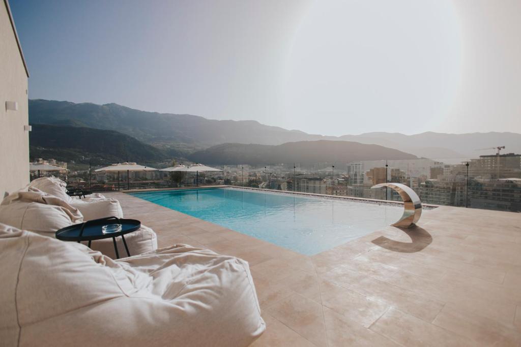 a swimming pool on top of a building at Infinity Hotel & More in Budva
