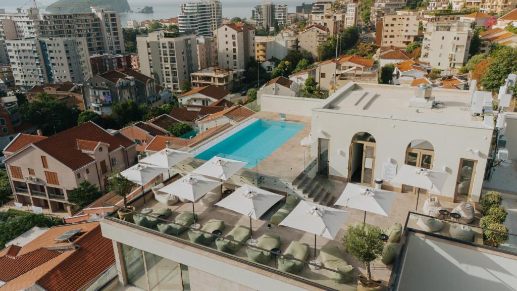 an aerial view of a building with a swimming pool at Infinity Hotel & More in Budva