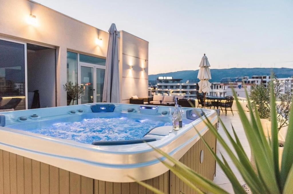 a jacuzzi tub on the balcony of a house at Boutique Hotel "Salina" in Ulcinj