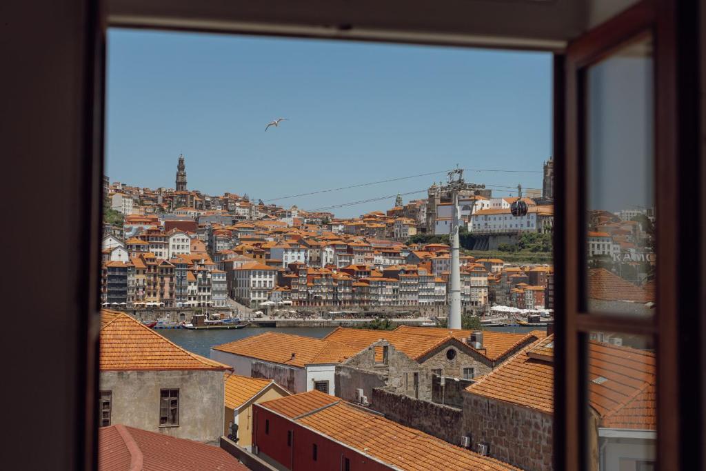 a view of a city from a window at Douro Panoramic Views by Vacationy in Bandeira