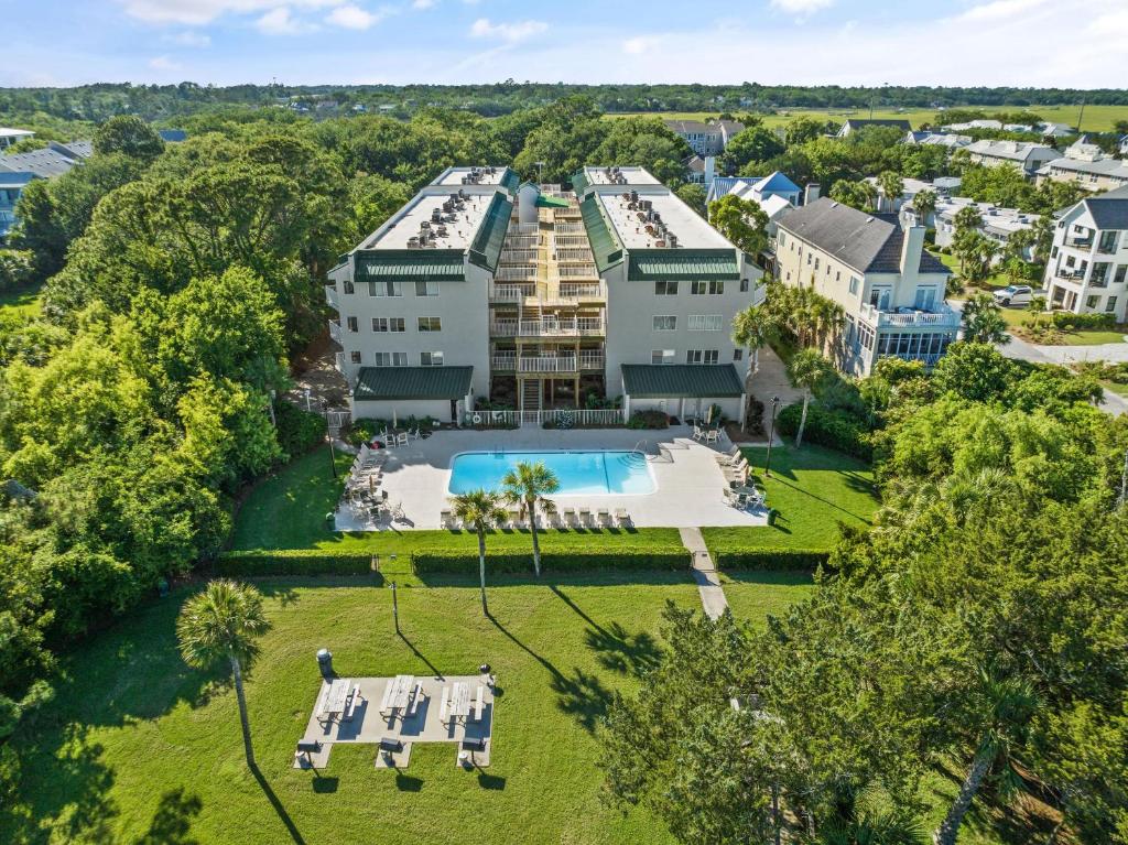 an aerial view of a mansion with a swimming pool and a resort at Shipwatch, Unit 113 - 1524 Wood Avenue in East End