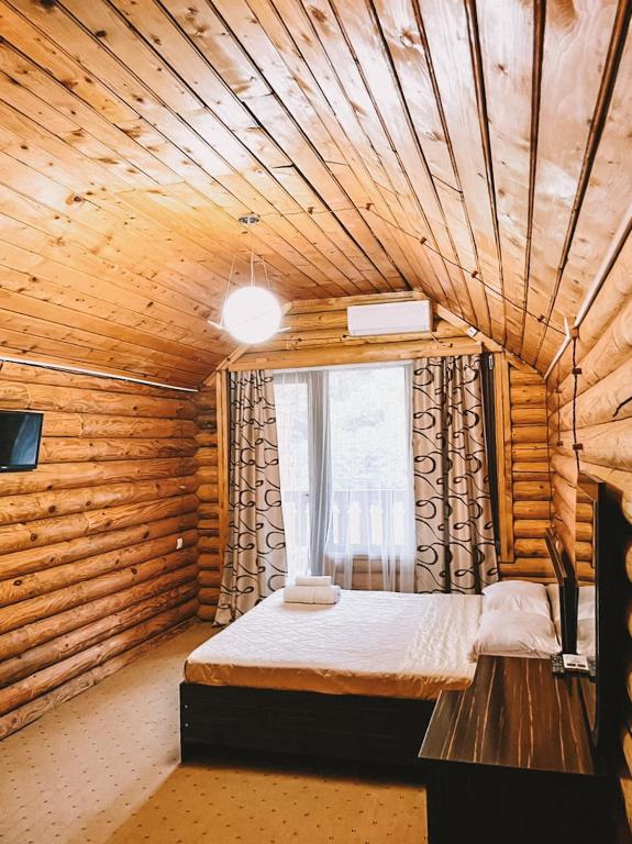 Postel nebo postele na pokoji v ubytování Hotel Chveneburi