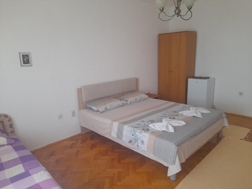 Postel nebo postele na pokoji v ubytování Tina Rooms