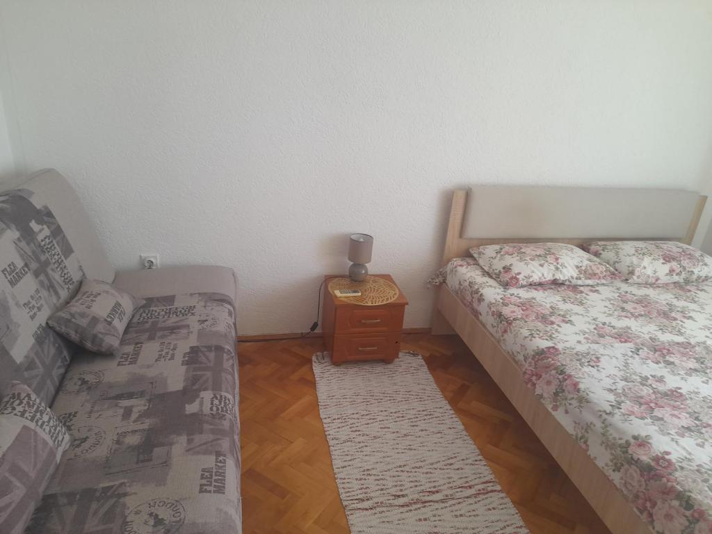Postel nebo postele na pokoji v ubytování Tina Rooms