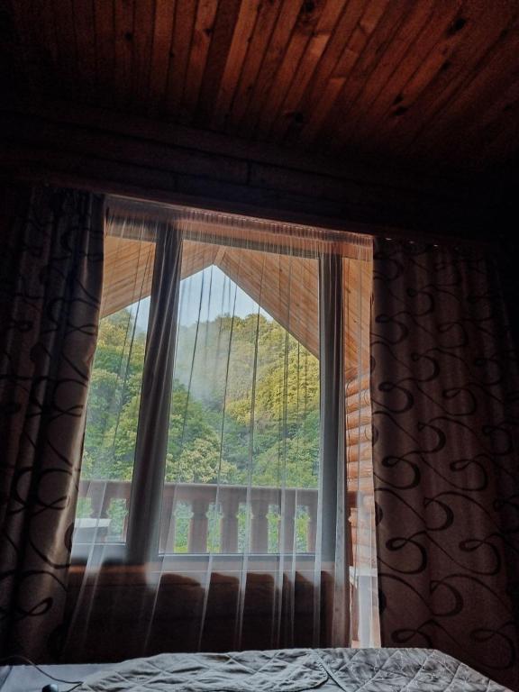 Postel nebo postele na pokoji v ubytování Hotel Chveneburi