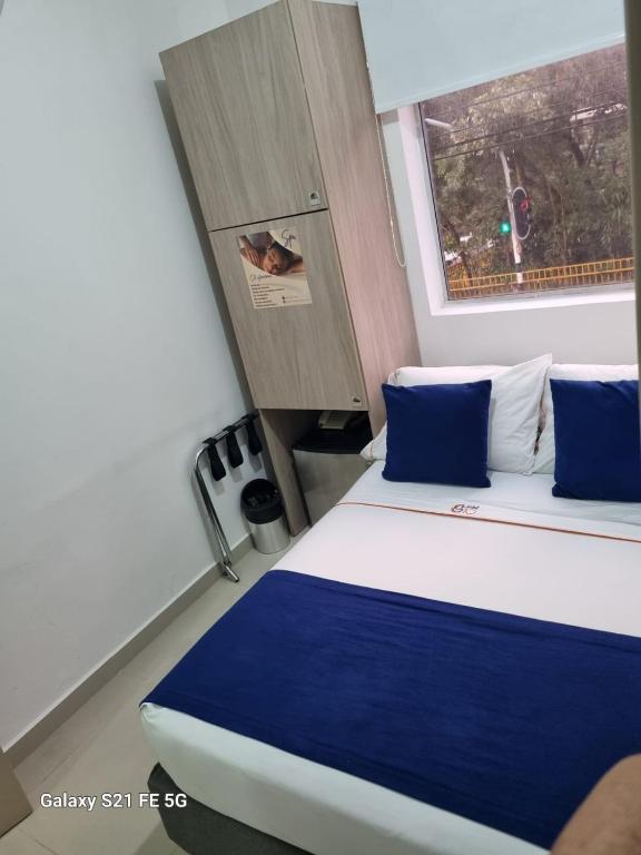 Postel nebo postele na pokoji v ubytování Hotel Casa 10