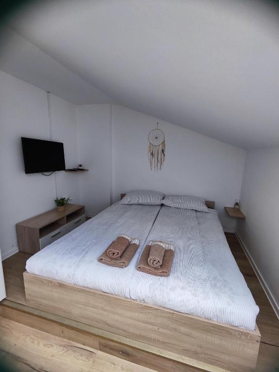 Postel nebo postele na pokoji v ubytování Apartments Tome