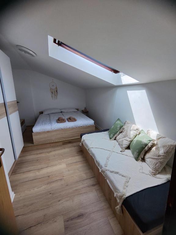 Postel nebo postele na pokoji v ubytování Apartments Tome