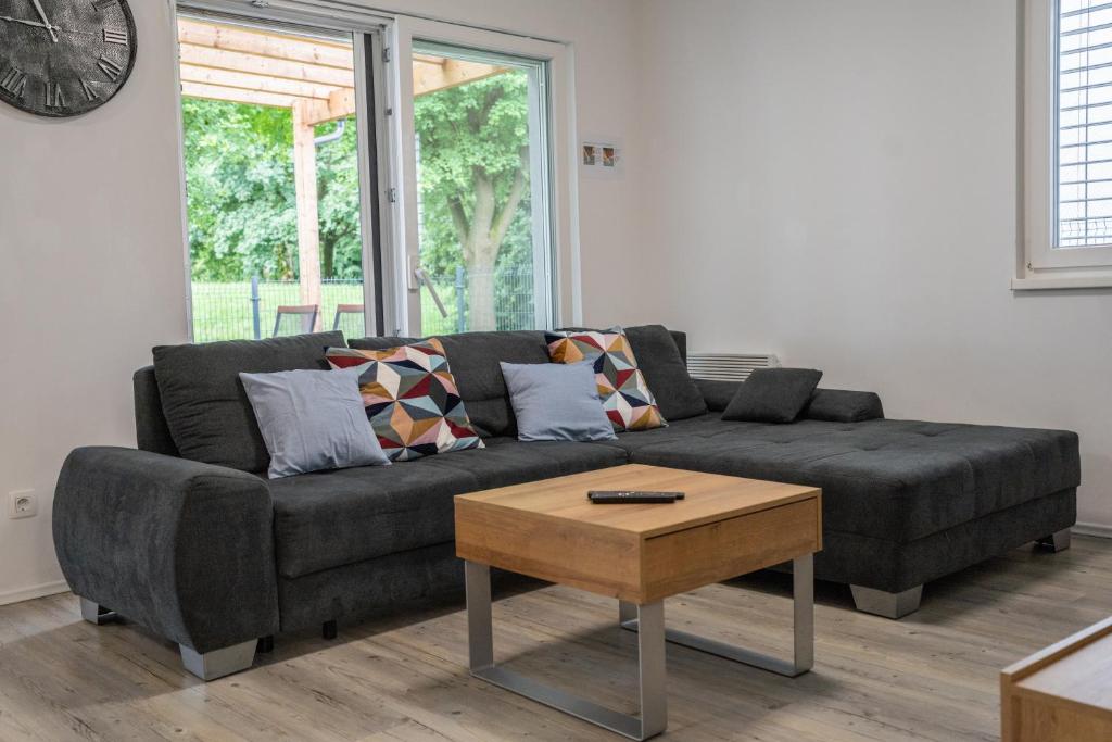 a living room with a couch and a coffee table at Apartment Swim and Relax in Moravske-Toplice