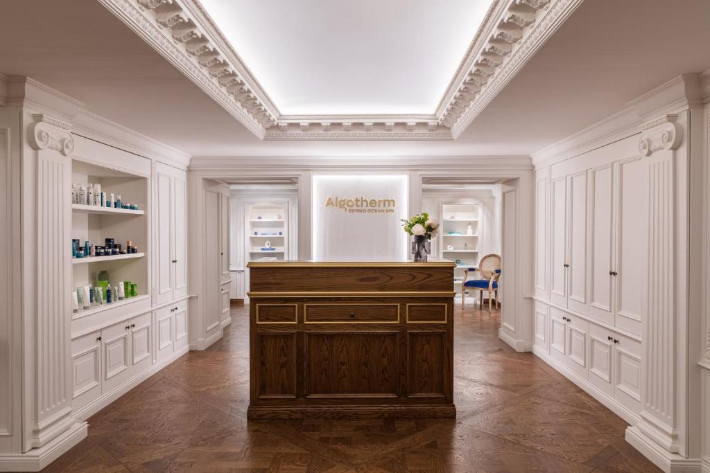a room with a podium in the middle of a building at InterContinental Paris Le Grand by IHG in Paris