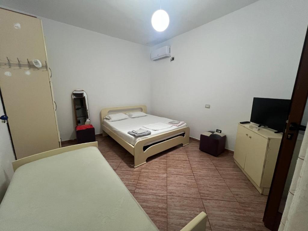Postel nebo postele na pokoji v ubytování Mateo Villa Vlore