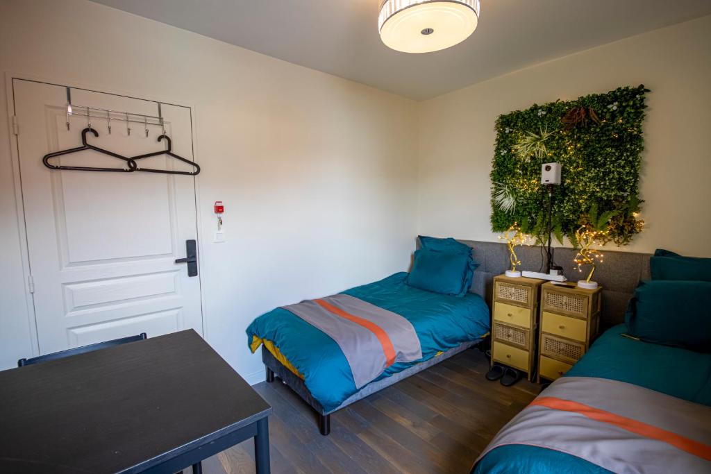 Postel nebo postele na pokoji v ubytování Cosy CoLiving space near Paris