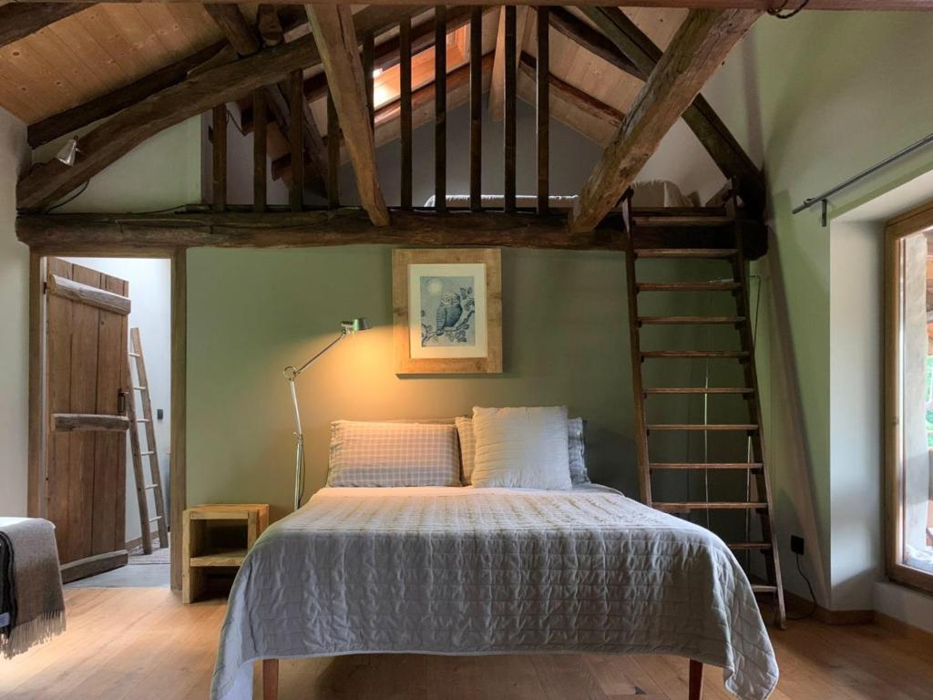 a bedroom with a bed with a loft at Affittacamere Montagne Verdi in Varallo