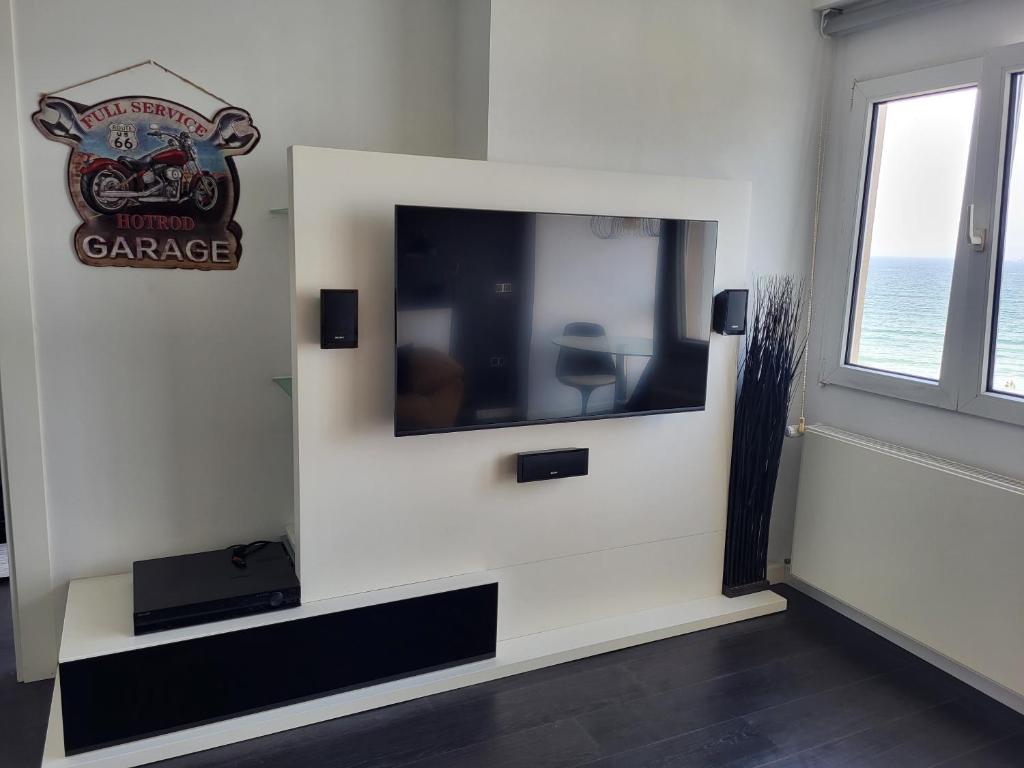 Телевизор и/или развлекательный центр в Apartamento Escalera 9