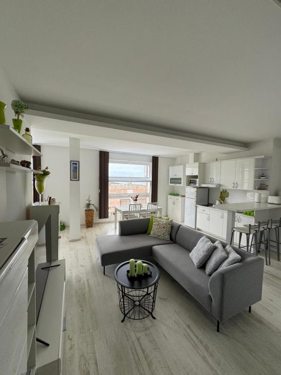 a living room with a couch and a table at Villa Lory in Makarska