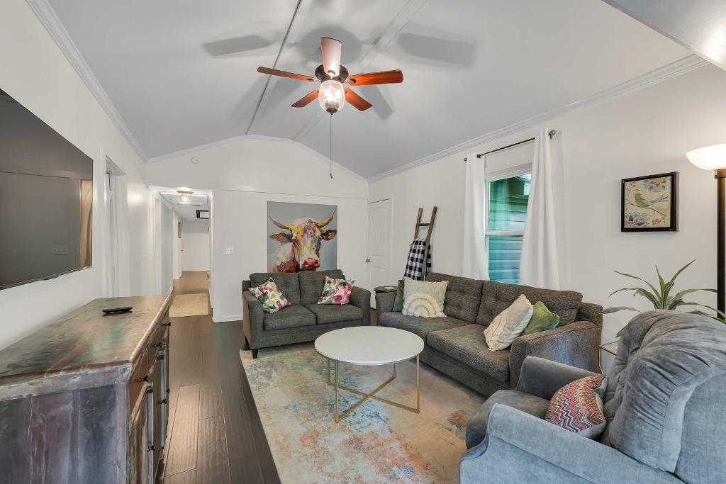 a living room with a couch and a ceiling fan at Pet-Friendly Pickens Vacation Rental with Fire Pit in Sunset