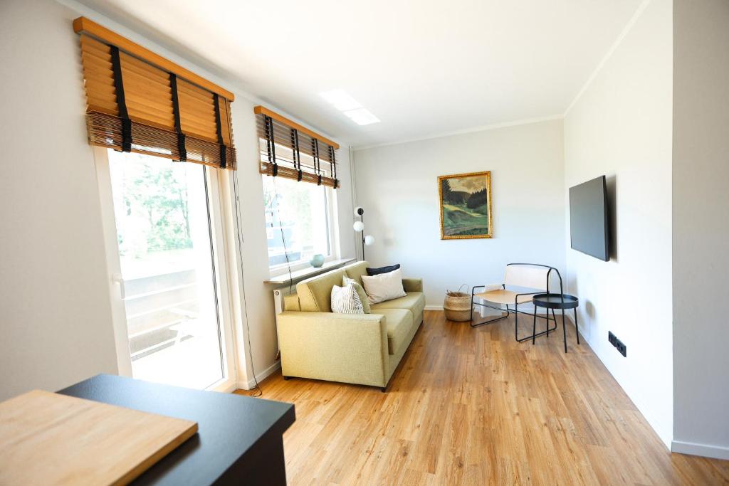 Μια τηλεόραση ή/και κέντρο ψυχαγωγίας στο Apartment Alm View, im Oberharz