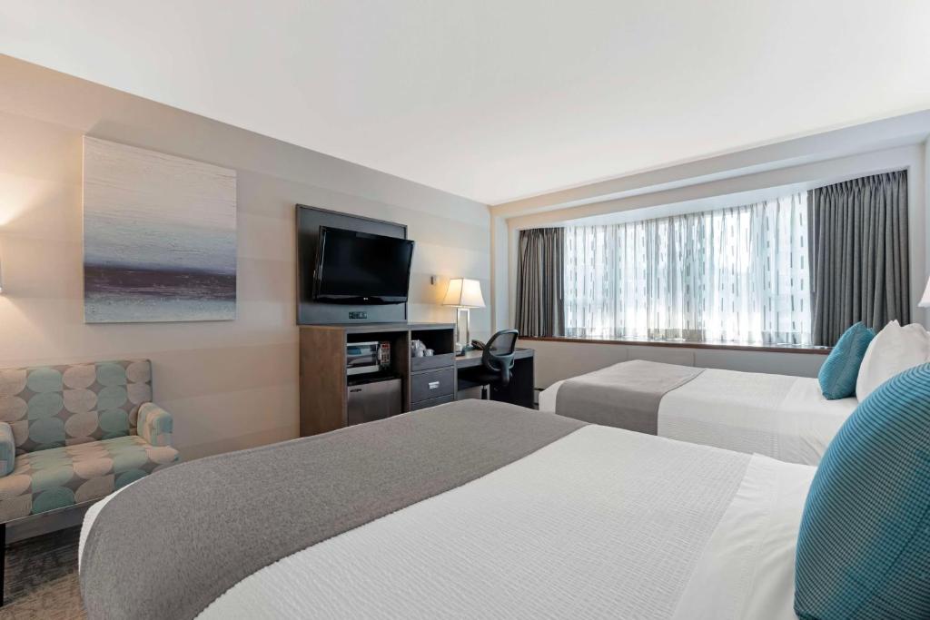 Postel nebo postele na pokoji v ubytování Best Western Plus Sands